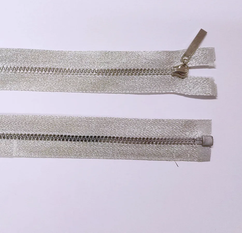 STŘÍBRNÁ * Kostěný zip délka 60 cm - kapsový